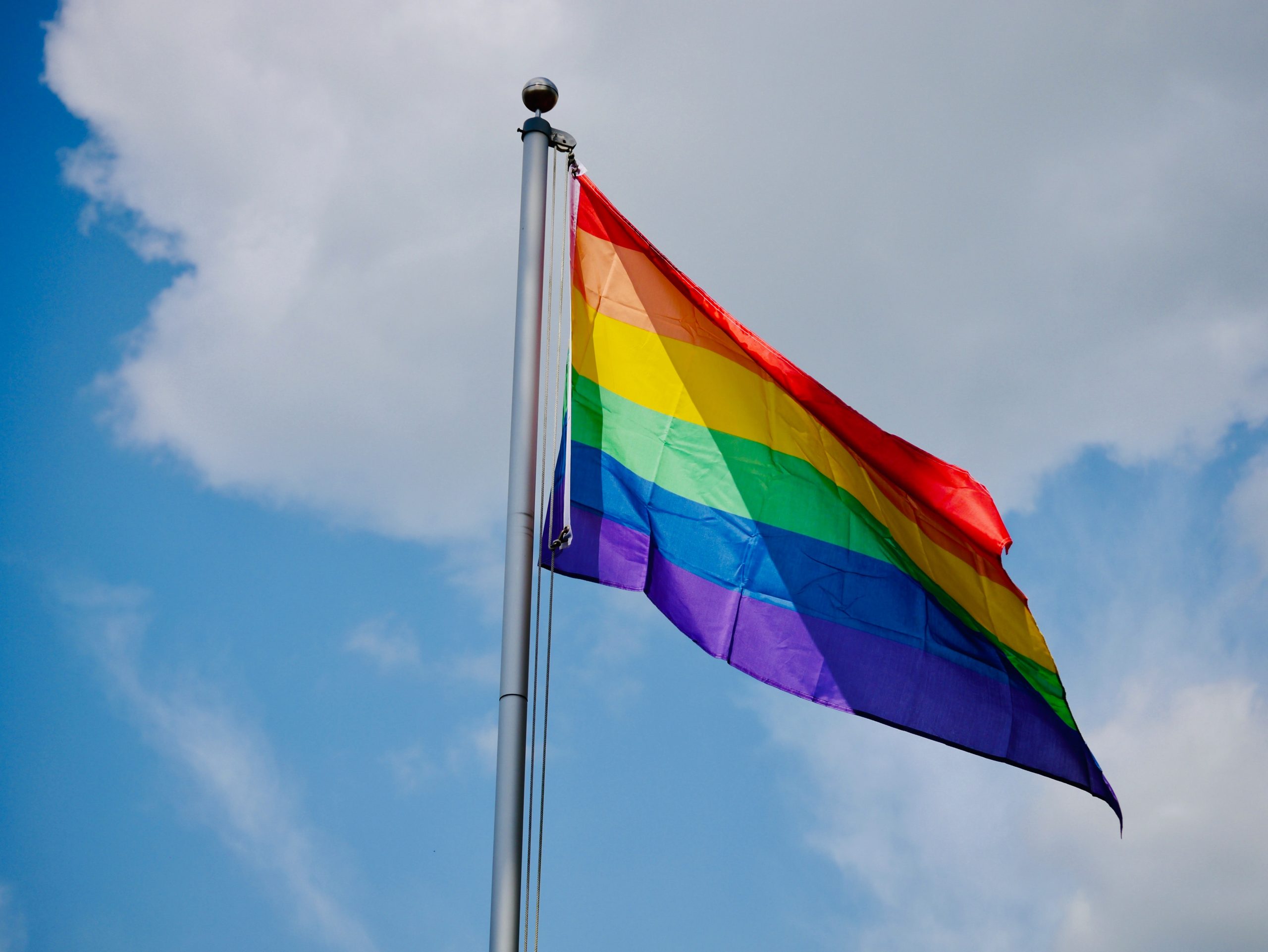 LGBTQ+ Pride Flag on a pole