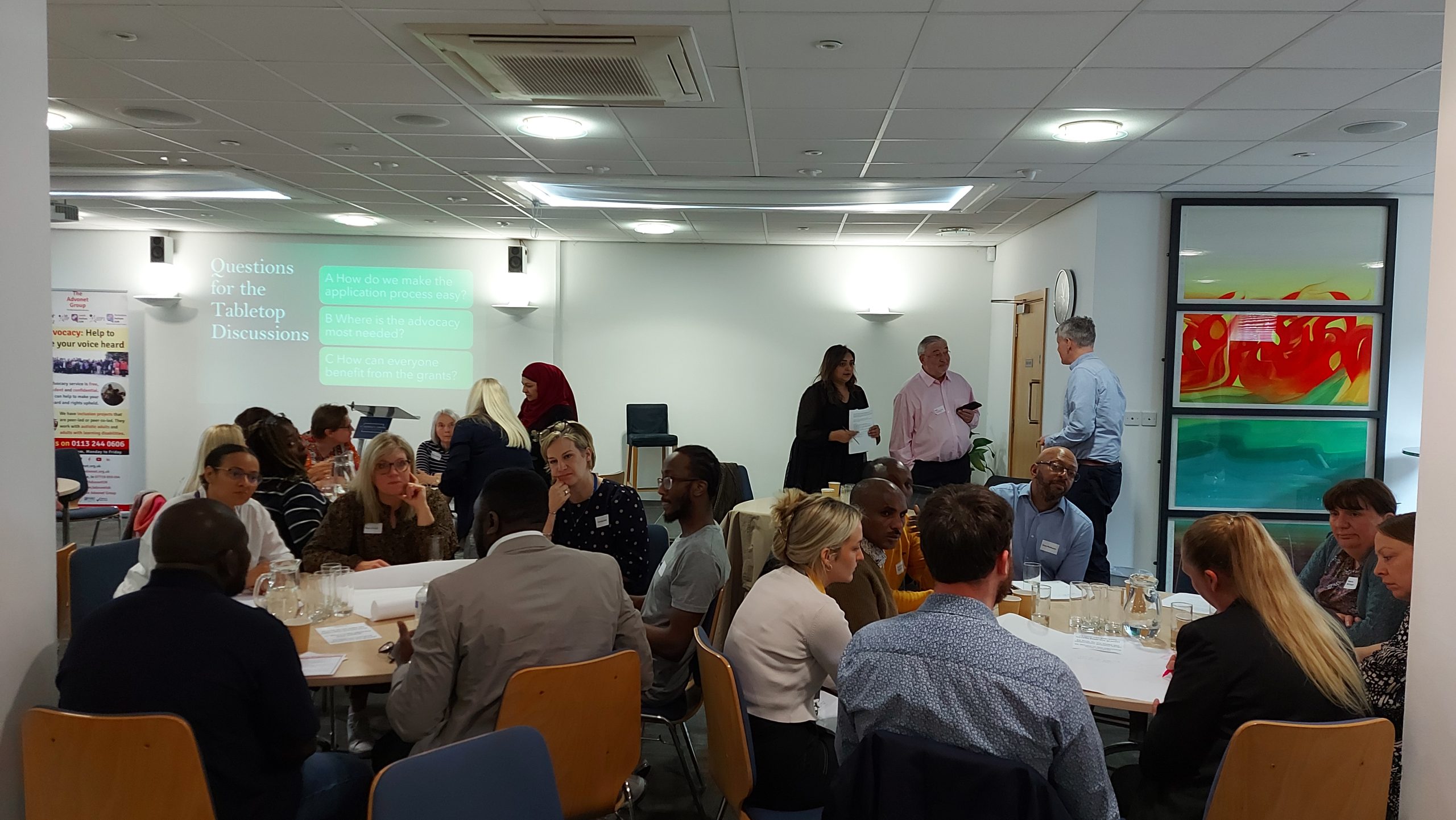 Discussion groups seated at tables for our Advocacy Development Fund event